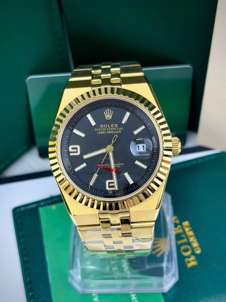 Đồng hồ Rolex Land-Dweller vàng gold mặt đen fake cao cấp 40mmĐồng hồ Rolex Land-Dweller vàng gold mặt đen fake cao cấp 40mm